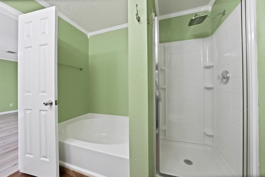4021 German Pointer Way Fort Worth, TX 76123 - Photo 31 of 38 a bathroom with a shower and a tub