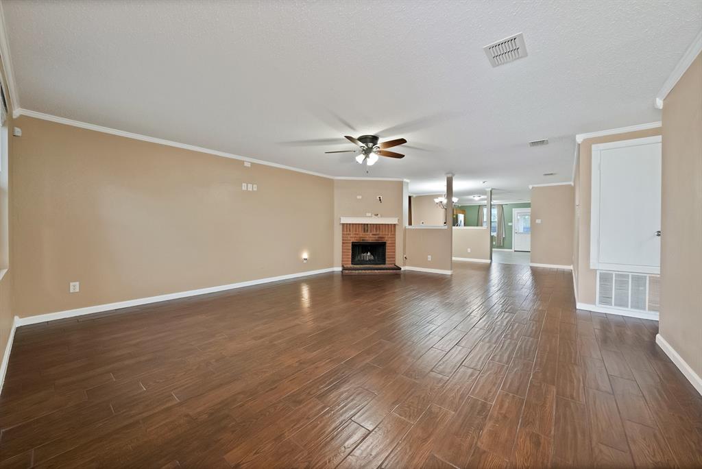 4021 German Pointer Way Fort Worth, TX 76123 - Photo 8 of 38 a view of a livingroom with furniture and wooden floor