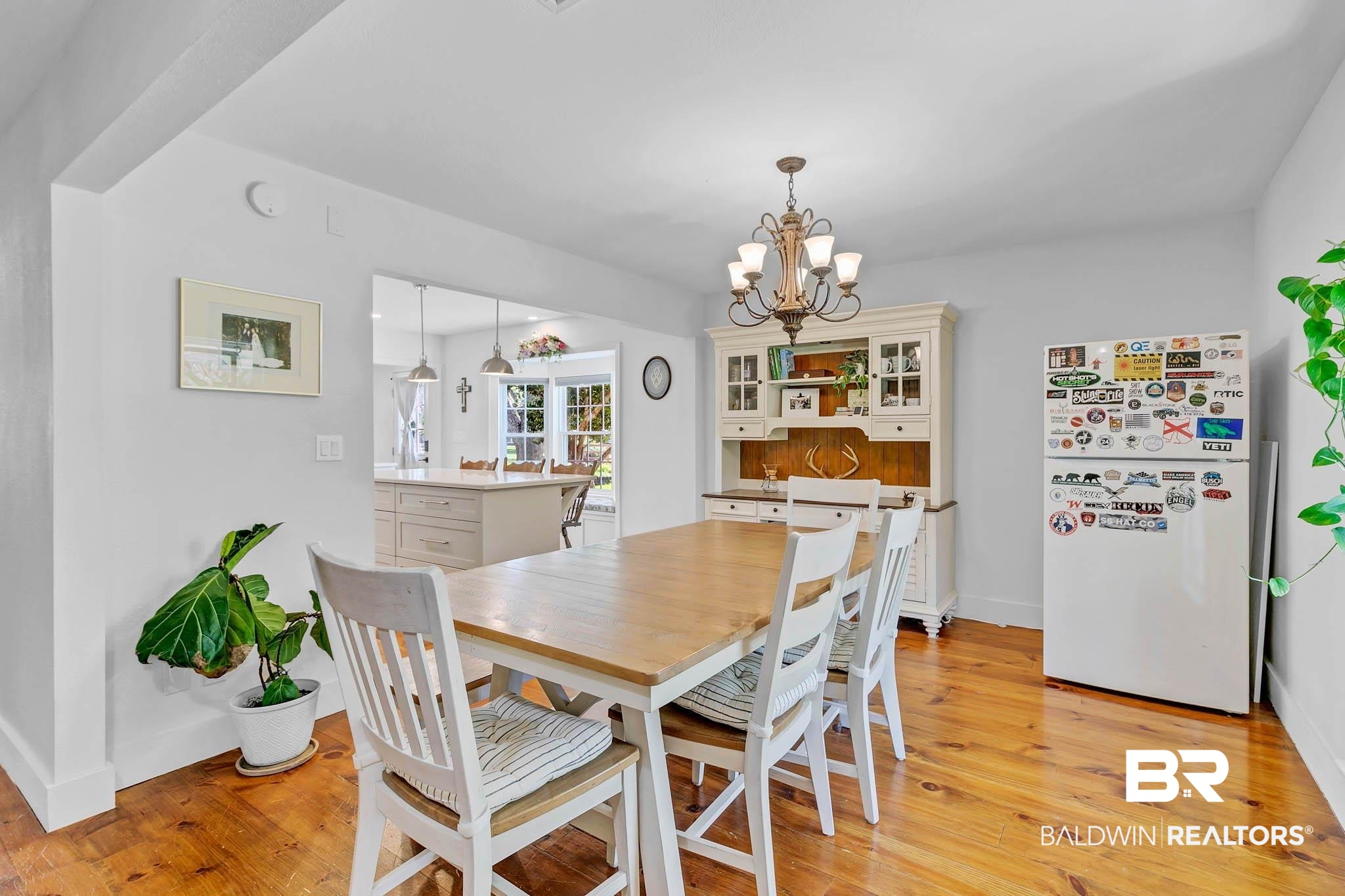7564 Rabbit Run Road Fairhope, AL 36532 - Photo 21 of 88 Dining room with a chandelier, light wood finished floors, and baseboards
