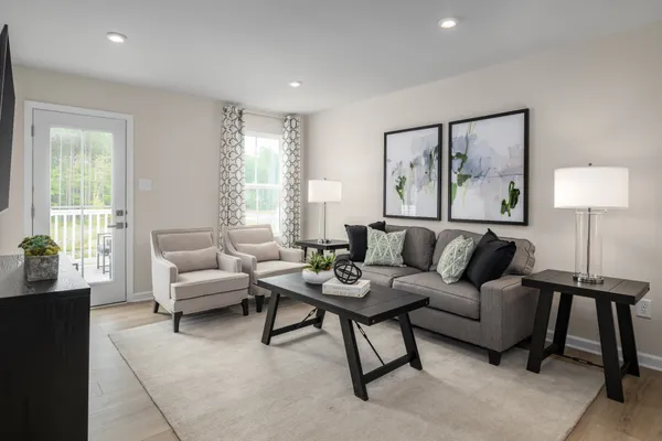 a living room with furniture and a large window