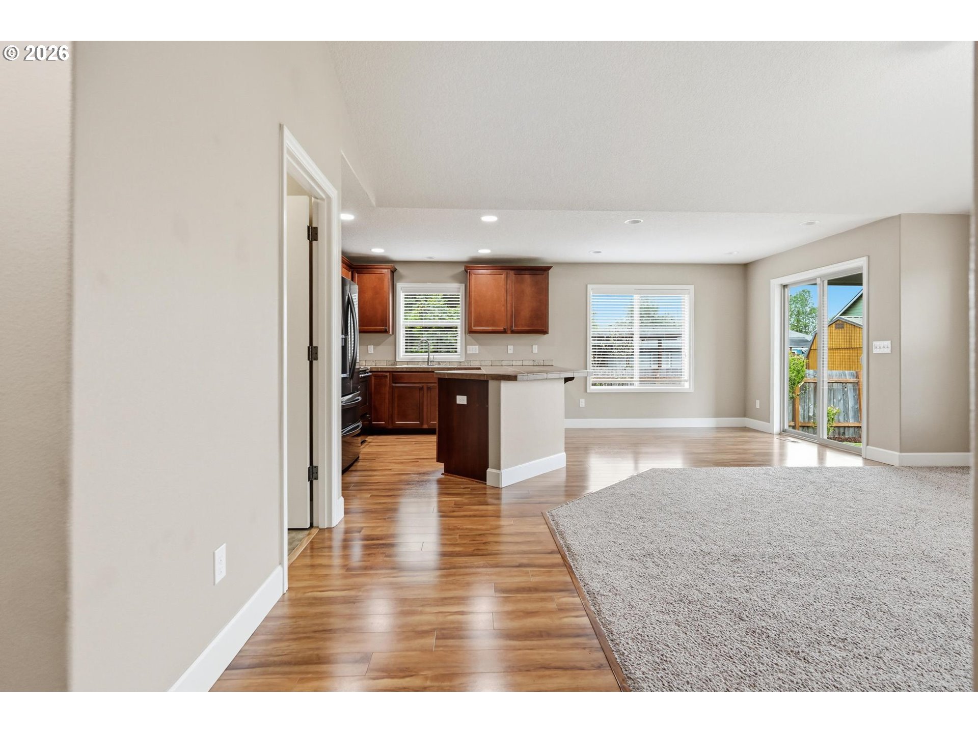 1075 Sage Street Silverton, OR 97381 - Photo 27 of 46 a view interior of a house and kitchen view with wooden floor