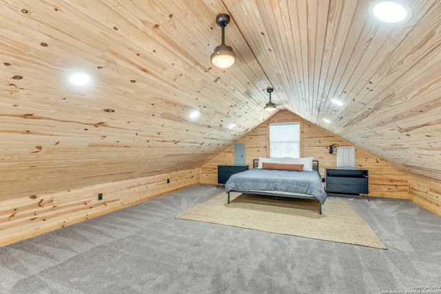 a bedroom with furniture and window