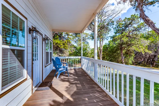 a view of a balcony with chairs