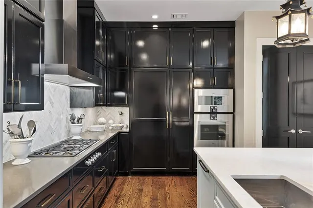 a kitchen with a refrigerator and a sink