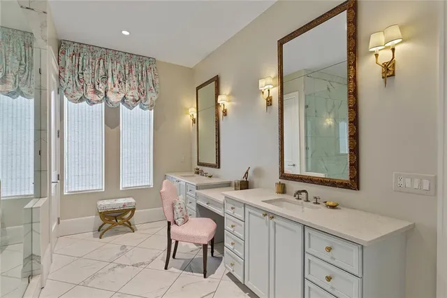 a bathroom with double sink and a mirror