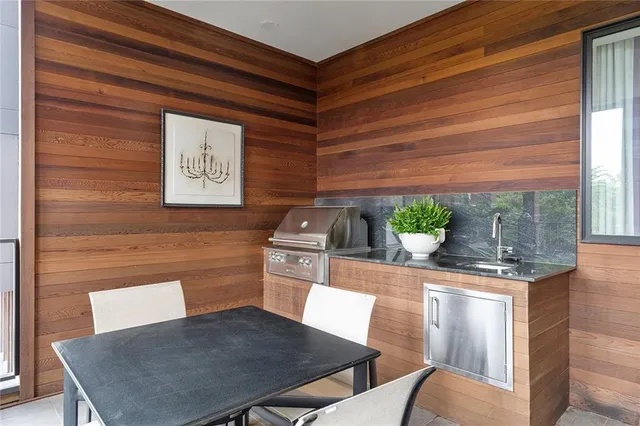 a kitchen view with table and chairs
