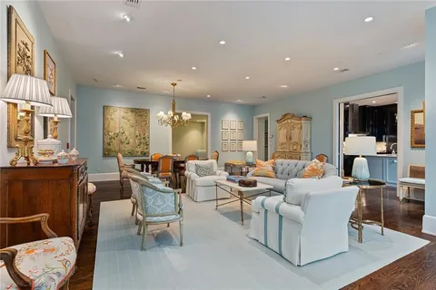 a living room with fireplace furniture and a flat screen tv