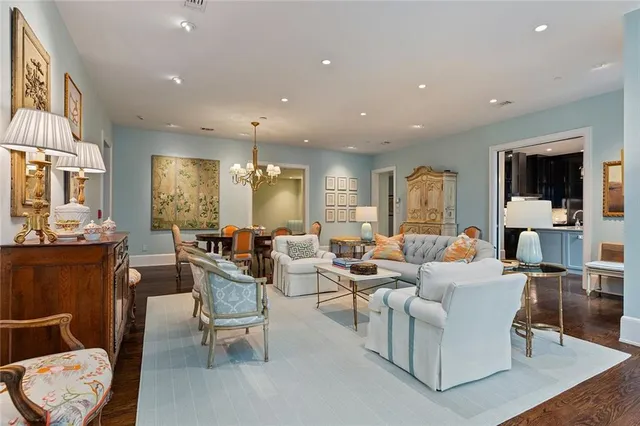 a living room with fireplace furniture and a flat screen tv
