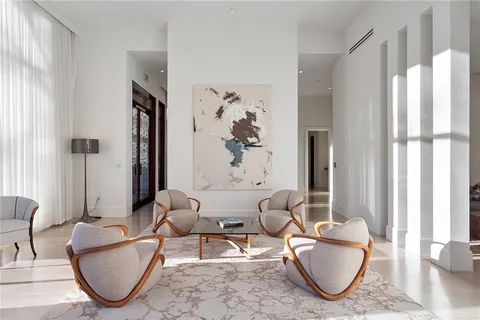 a living room with furniture a window and a table