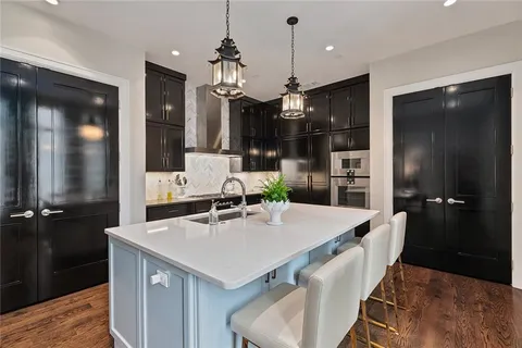 a kitchen with a table and chairs in it