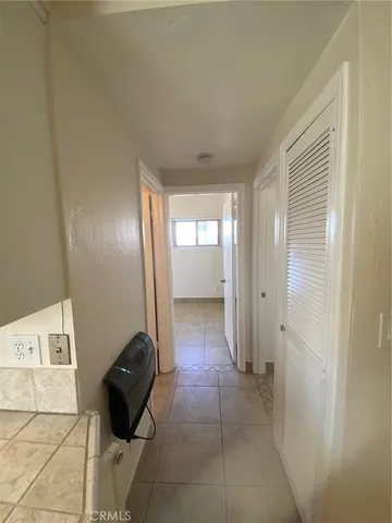 a bathroom with a double vanity sink toilet mirror and bathtub