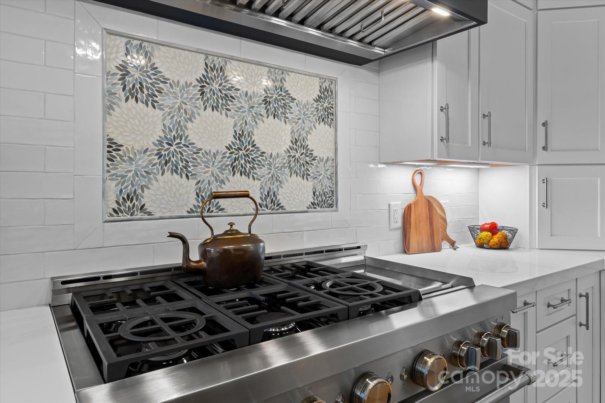 18916 Riverwind Lane Davidson, NC 28036 - Photo 13 of 38 a stove top oven sitting inside of a kitchen