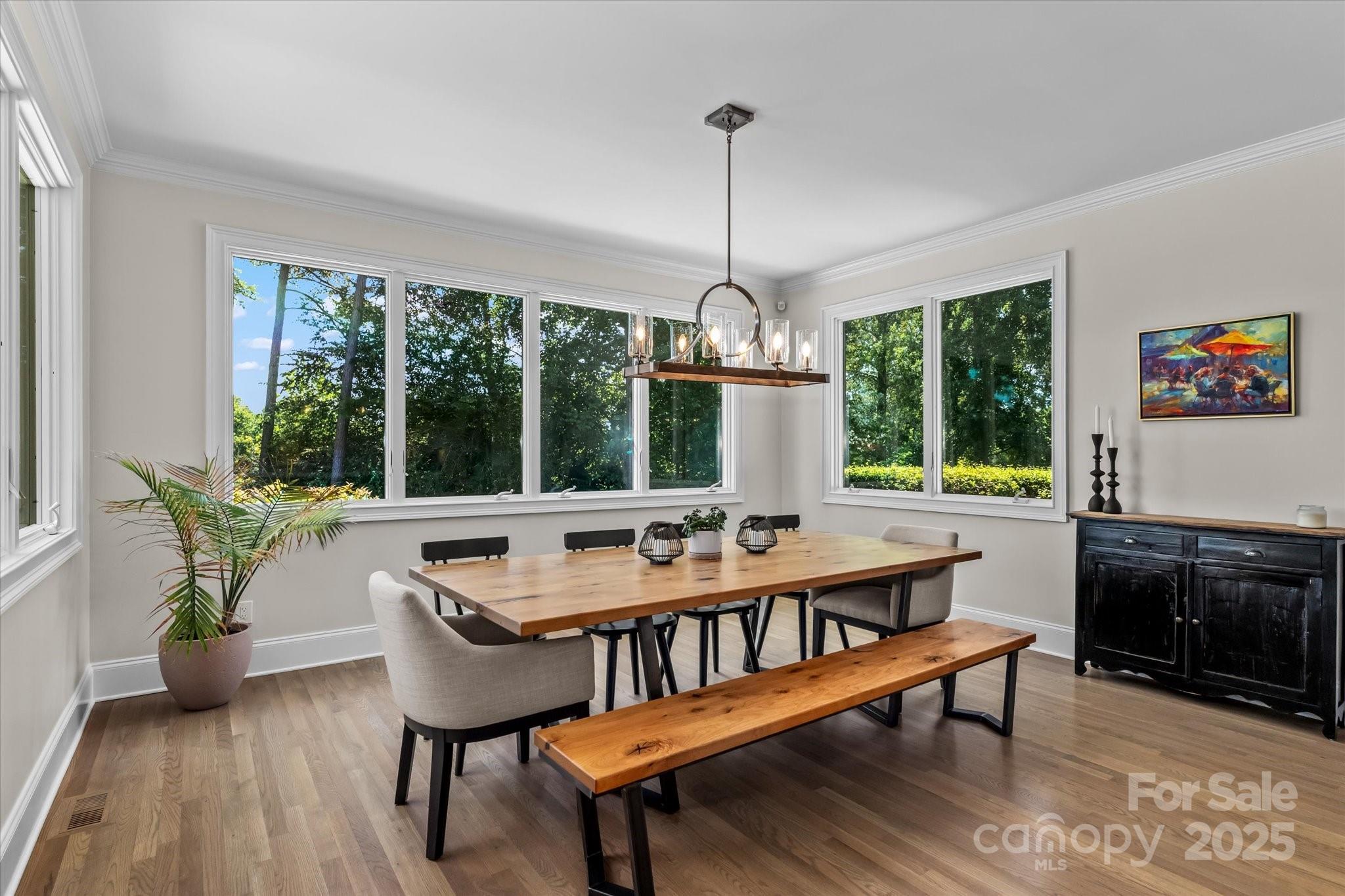 18916 Riverwind Lane Davidson, NC 28036 - Photo 15 of 38 a view of a dining room with furniture window and outside view