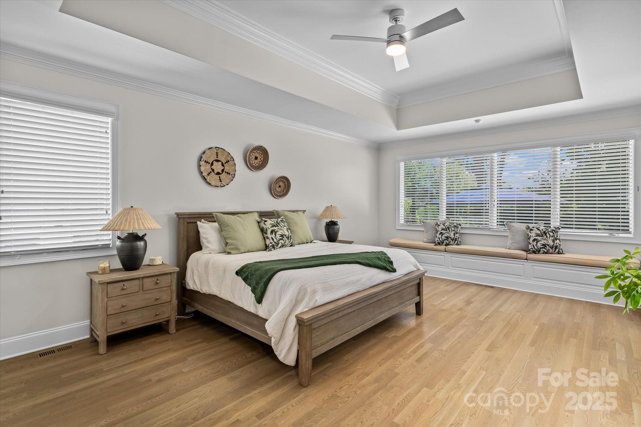 18916 Riverwind Lane Davidson, NC 28036 - Photo 17 of 38 a bedroom with a large bed and a large window