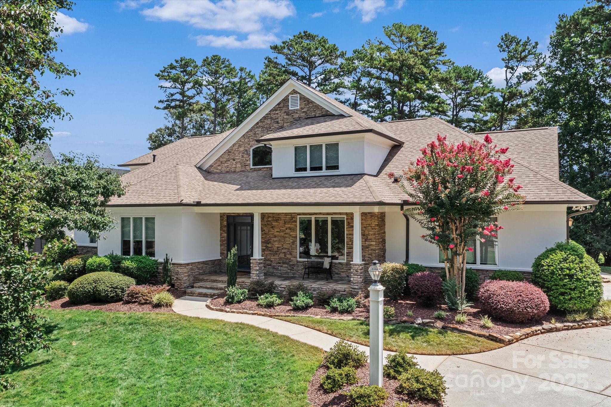 18916 Riverwind Lane Davidson, NC 28036 - Photo 2 of 38 a front view of house with yard and green space