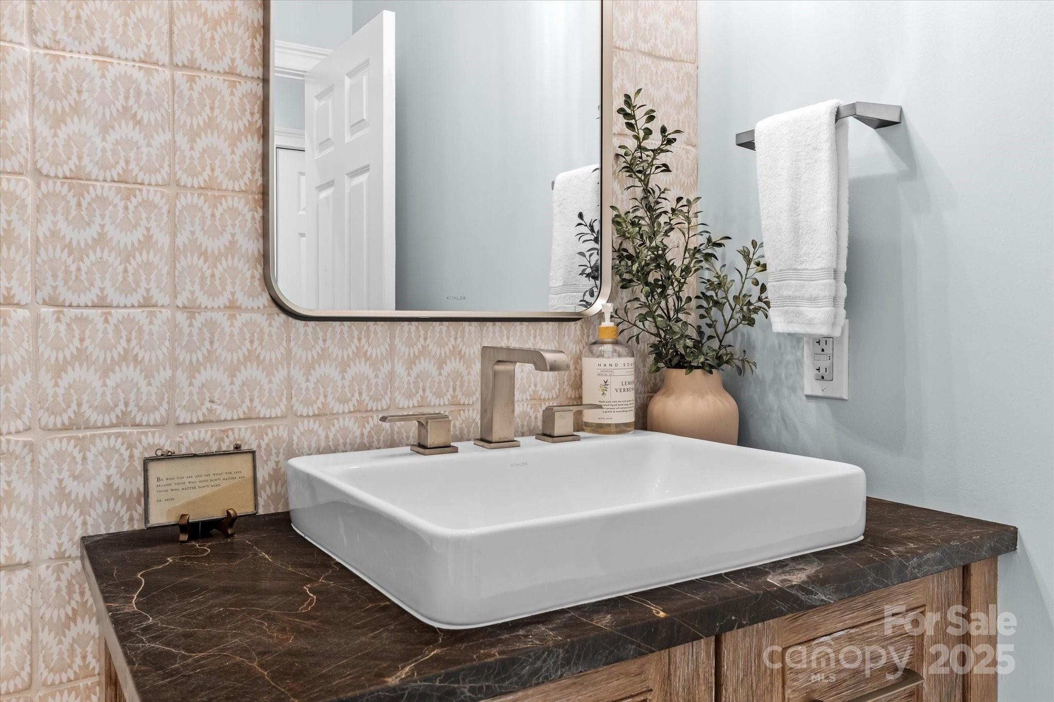 18916 Riverwind Lane Davidson, NC 28036 - Photo 23 of 38 a bathroom with a sink and a mirror