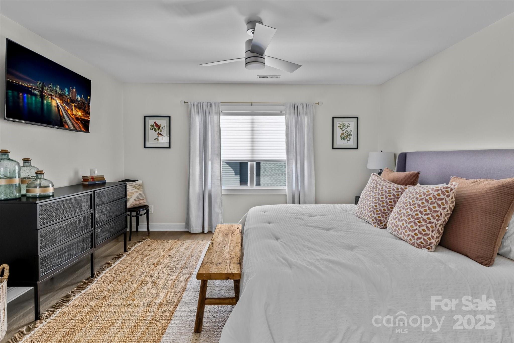 18916 Riverwind Lane Davidson, NC 28036 - Photo 27 of 38 a bedroom with a large bed and a window