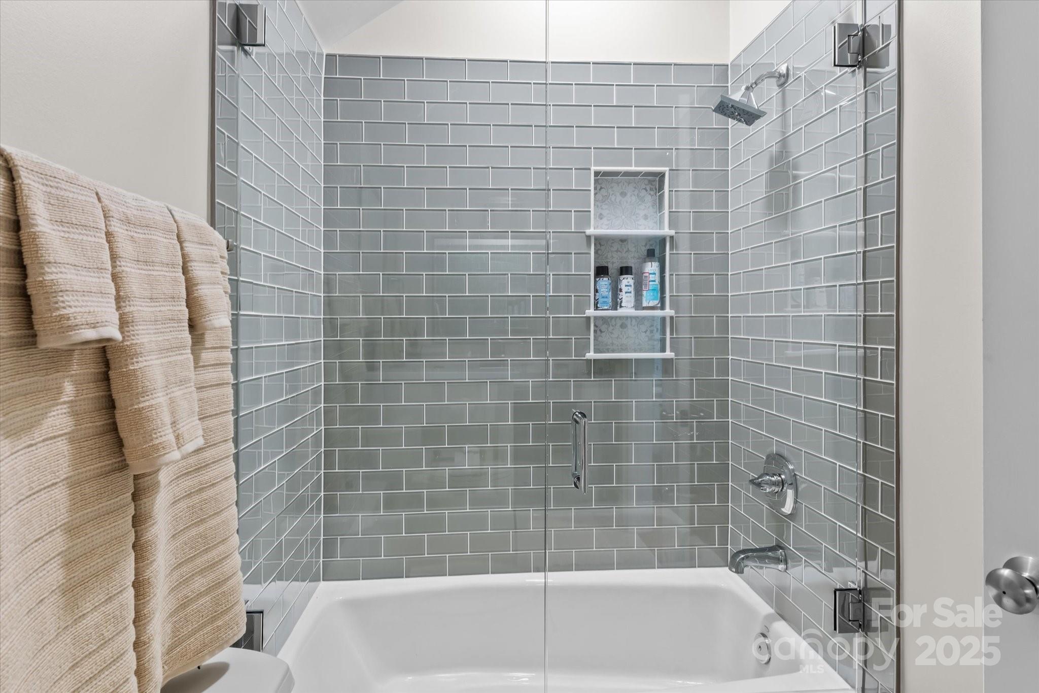 18916 Riverwind Lane Davidson, NC 28036 - Photo 30 of 38 a bathroom with a bathtub and shower