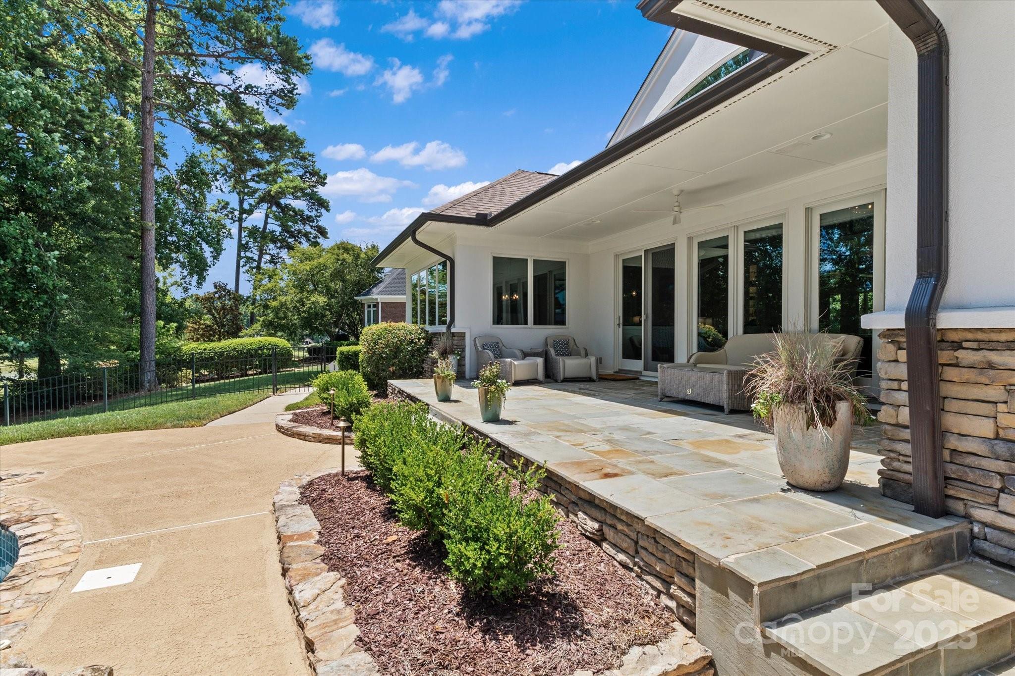 18916 Riverwind Lane Davidson, NC 28036 - Photo 31 of 38 a view of a house with backyard and sitting area