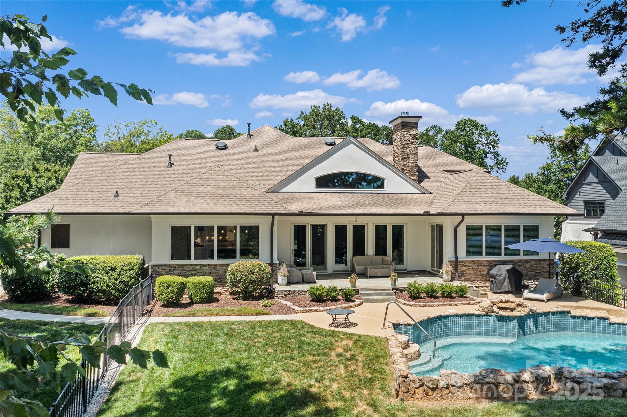 18916 Riverwind Lane Davidson, NC 28036 - Photo 33 of 38 a front view of a house with garden and yard