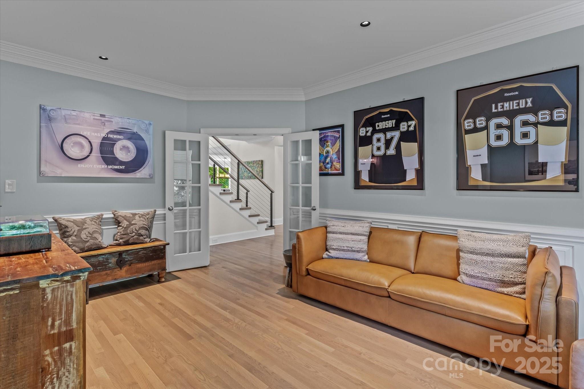18916 Riverwind Lane Davidson, NC 28036 - Photo 5 of 38 a living room with furniture and paintings on the wall