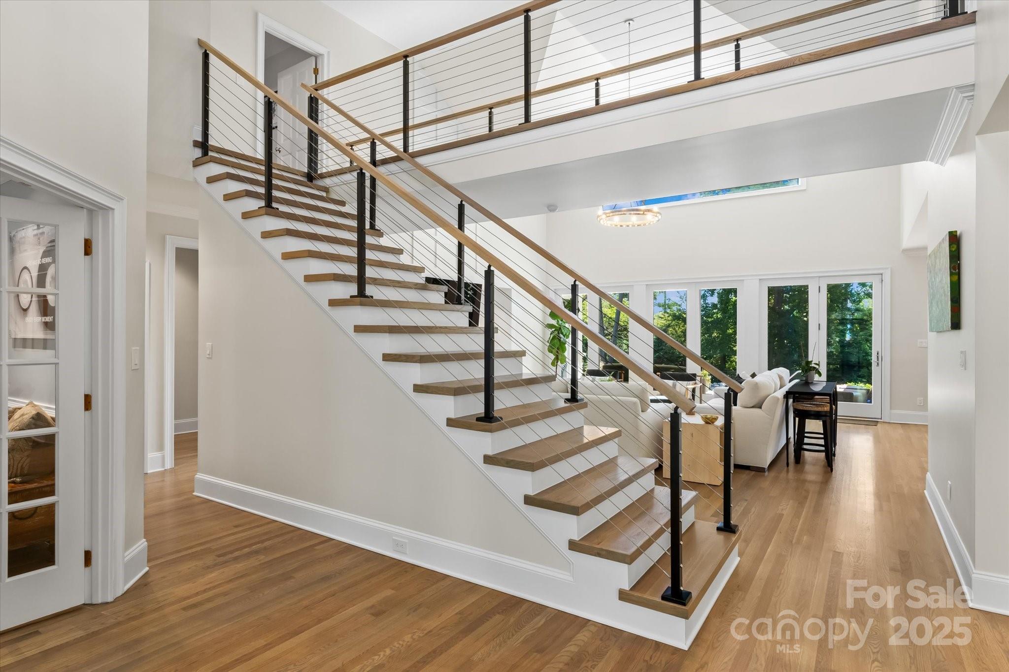 18916 Riverwind Lane Davidson, NC 28036 - Photo 6 of 38 a view of entryway and hall with wooden floor