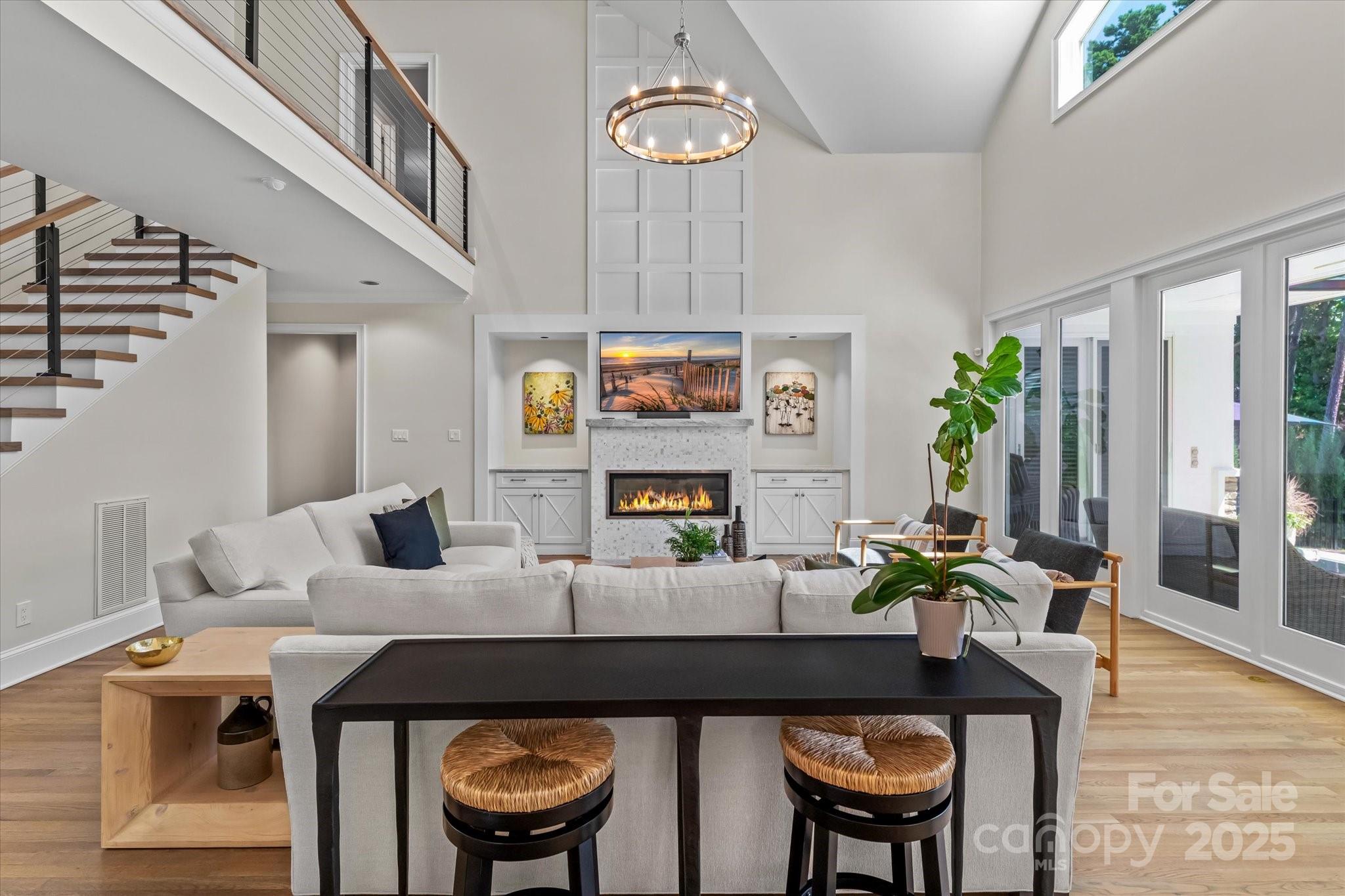 18916 Riverwind Lane Davidson, NC 28036 - Photo 9 of 38 a living room with furniture and a table