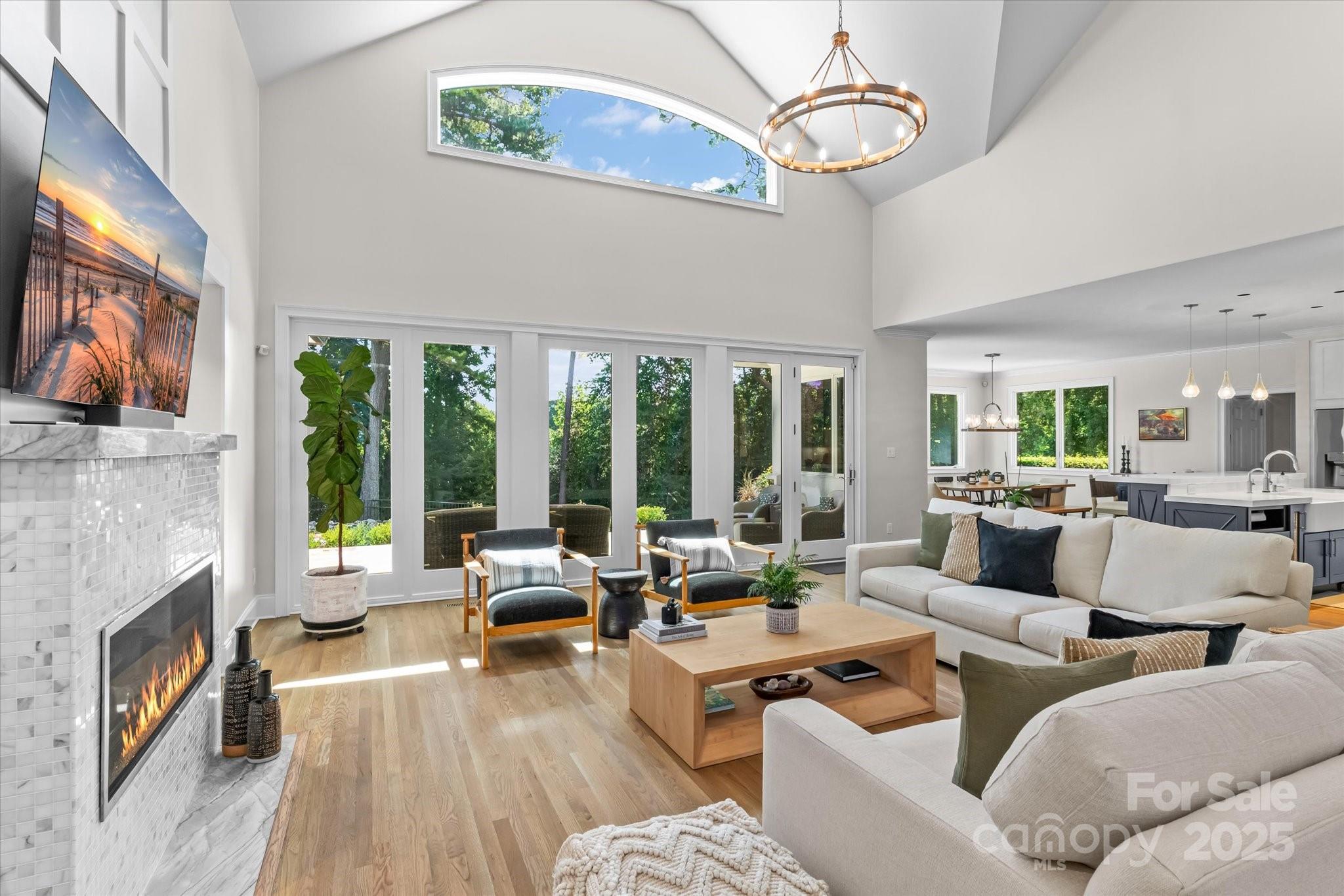 18916 Riverwind Lane Davidson, NC 28036 - Photo 10 of 38 a living room with furniture fireplace and flat screen tv