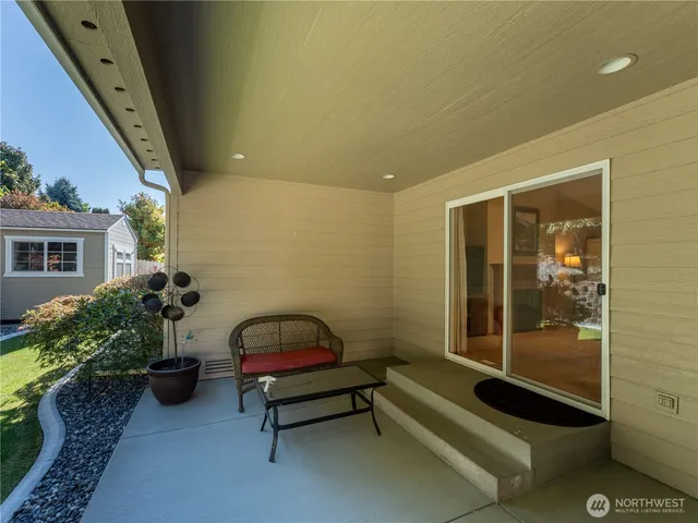 a building outdoor space with furniture and potted plants