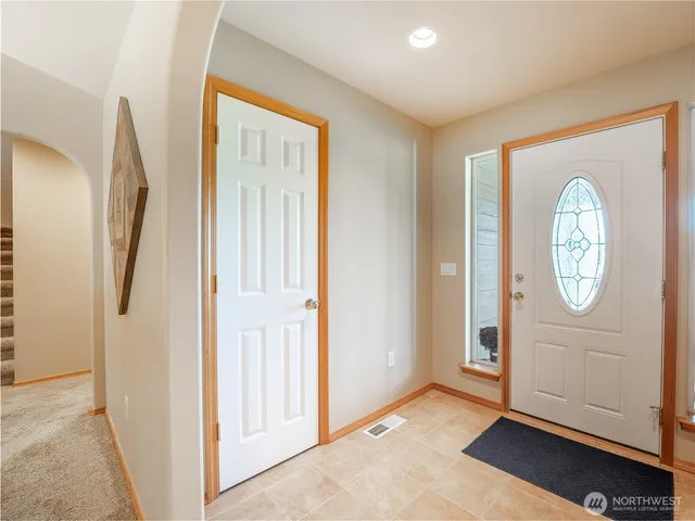 a view of a hallway with front door