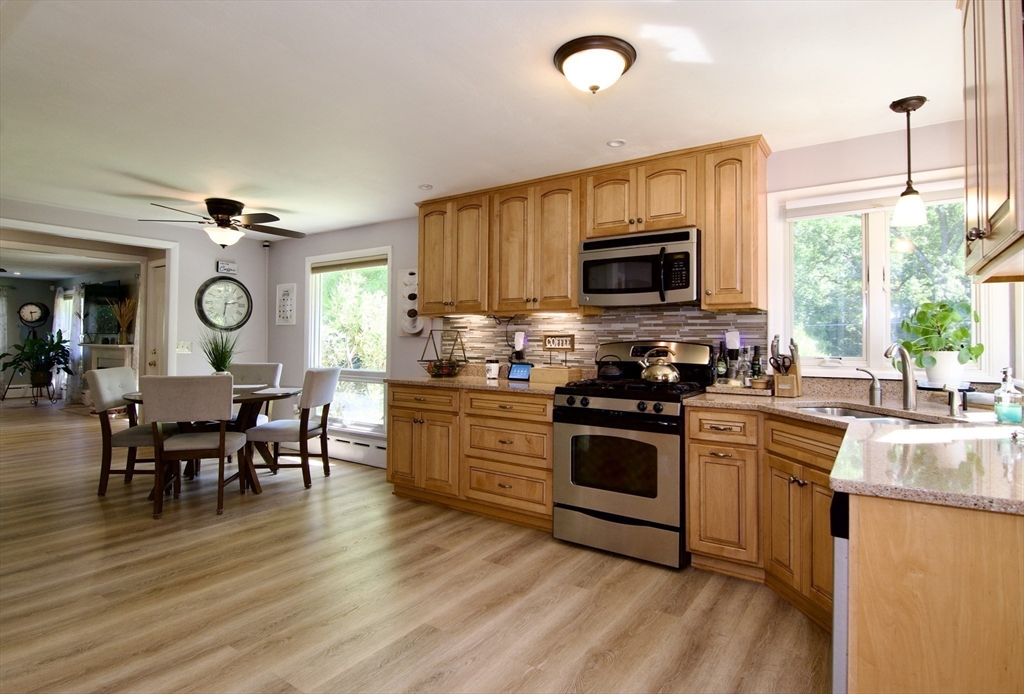 1070 Plumtree Road Springfield, MA 01119 - Photo 11 of 40 a kitchen with a stove top oven sink and cabinets
