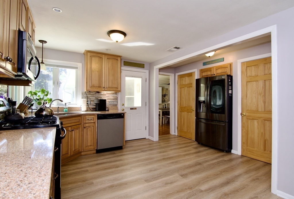 1070 Plumtree Road Springfield, MA 01119 - Photo 12 of 40 a kitchen with a refrigerator and a sink
