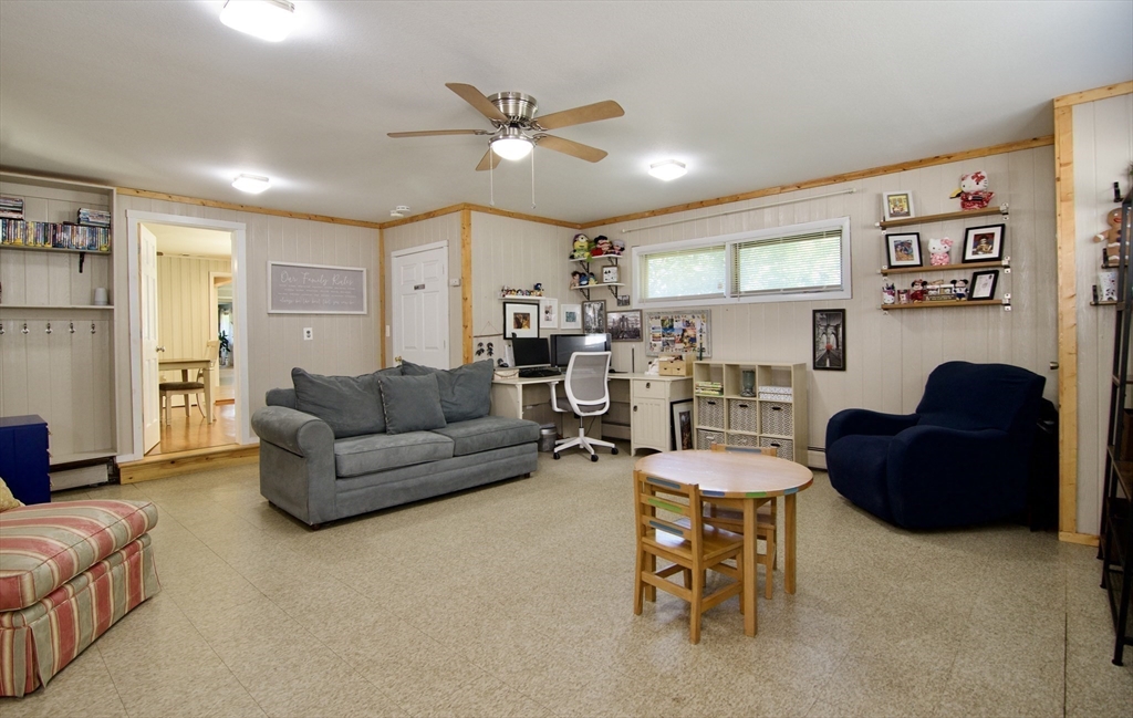 1070 Plumtree Road Springfield, MA 01119 - Photo 19 of 40 a living room with furniture and a chandelier