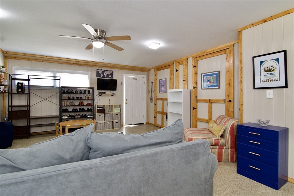 1070 Plumtree Road Springfield, MA 01119 - Photo 20 of 40 a living room with furniture and a flat screen tv