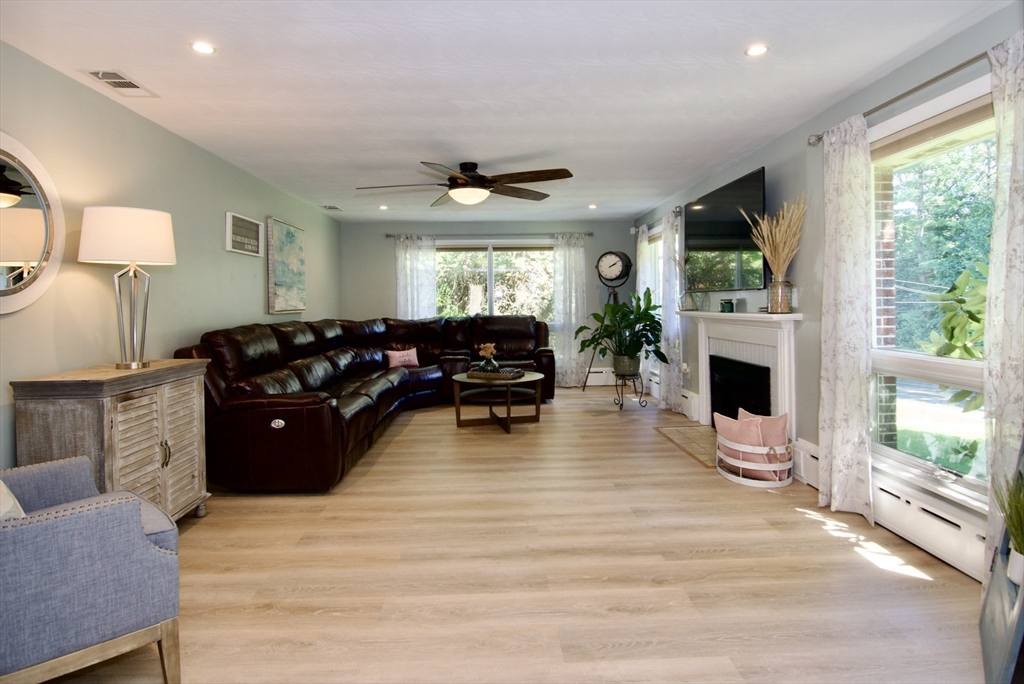 1070 Plumtree Road Springfield, MA 01119 - Photo 3 of 40 a living room with furniture fireplace and flat screen tv