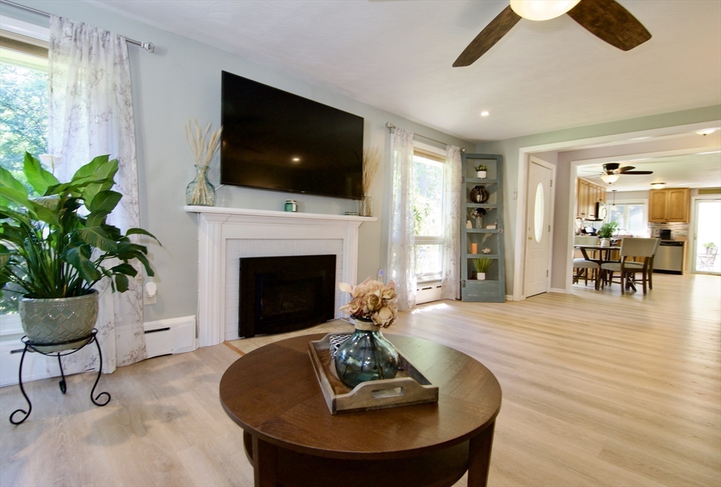 1070 Plumtree Road Springfield, MA 01119 - Photo 5 of 40 a living room with furniture and a fireplace