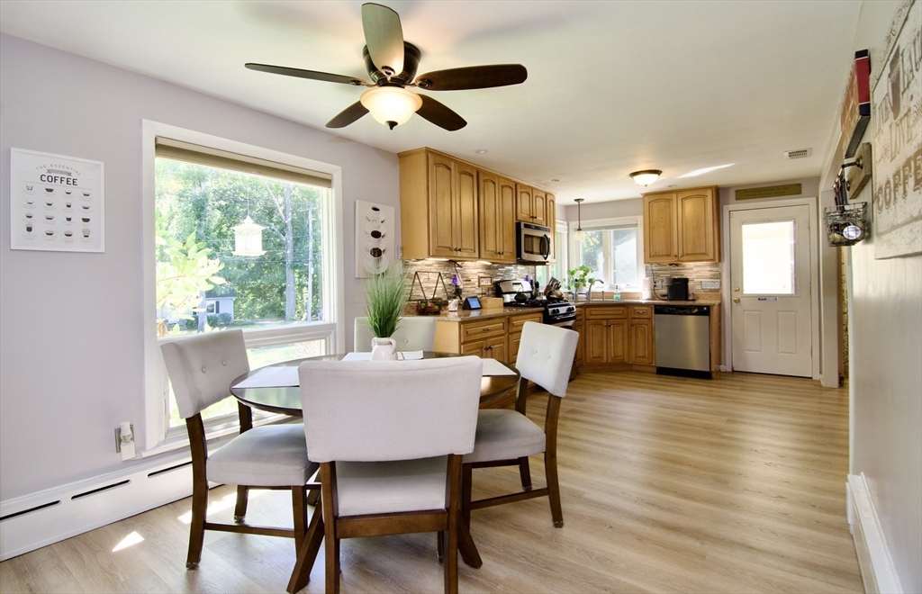 1070 Plumtree Road Springfield, MA 01119 - Photo 7 of 40 a view of a dining room with furniture window and wooden floor