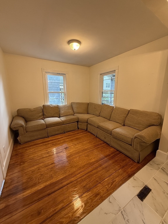 10 Bucknam Street, Unit 1 (NOW) Boston, MA 02120 - Photo 4 of 8 a living room with furniture and a couch
