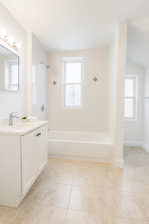10 Bucknam Street, Unit 1 (NOW) Boston, MA 02120 - Photo 8 of 8 a spacious bathroom with a bathtub sink and mirror