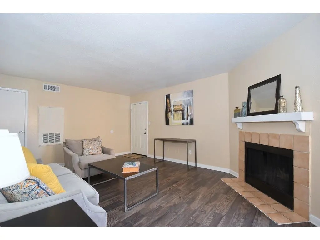 17310 Kieth Harrow Boulevard, Unit 212 Houston, TX 77084 - Photo 20 of 20 a living room with furniture and a fireplace