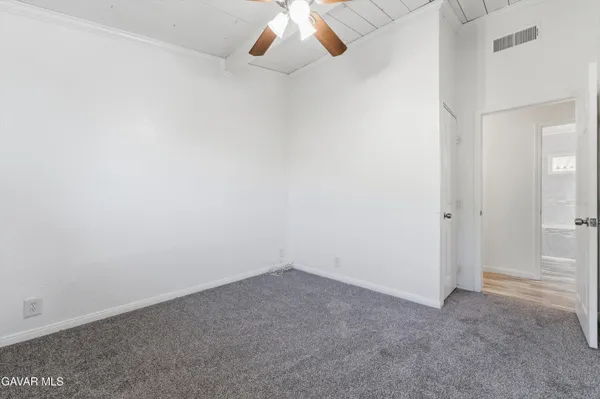 a bathroom with a granite countertop toilet a sink and bathtub