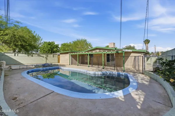 a backyard of a house with seating space