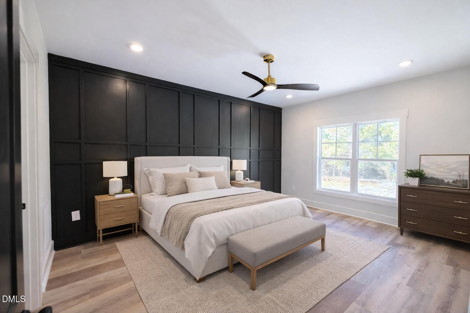 444 Park Springs Road Providence, NC 27315 - Photo 6 of 10 a bedroom with a large bed and a chandelier