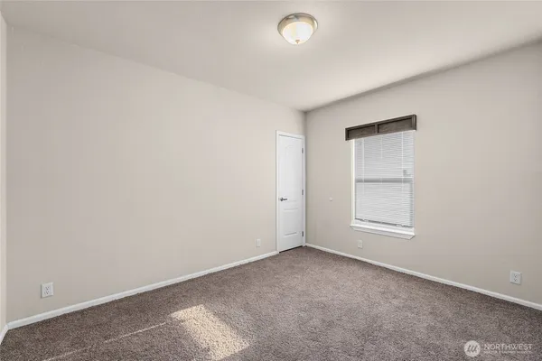 an empty room with a empty space and window