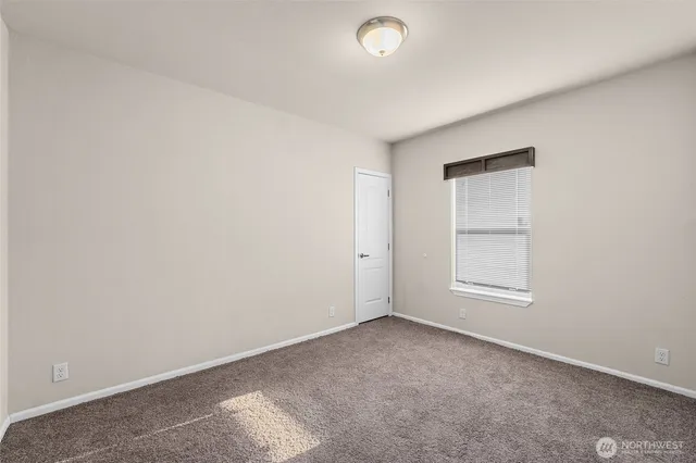 an empty room with a empty space and window