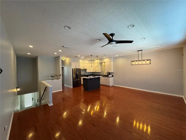 a view of a kitchen with a sink and a stove