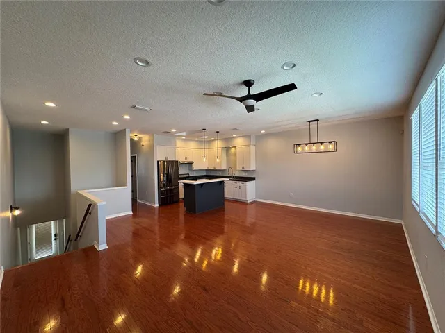 a view of kitchen and dining room with wooden floor