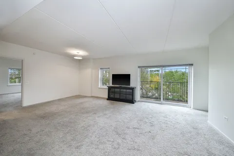 a view of a livingroom with an empty space and a fireplace