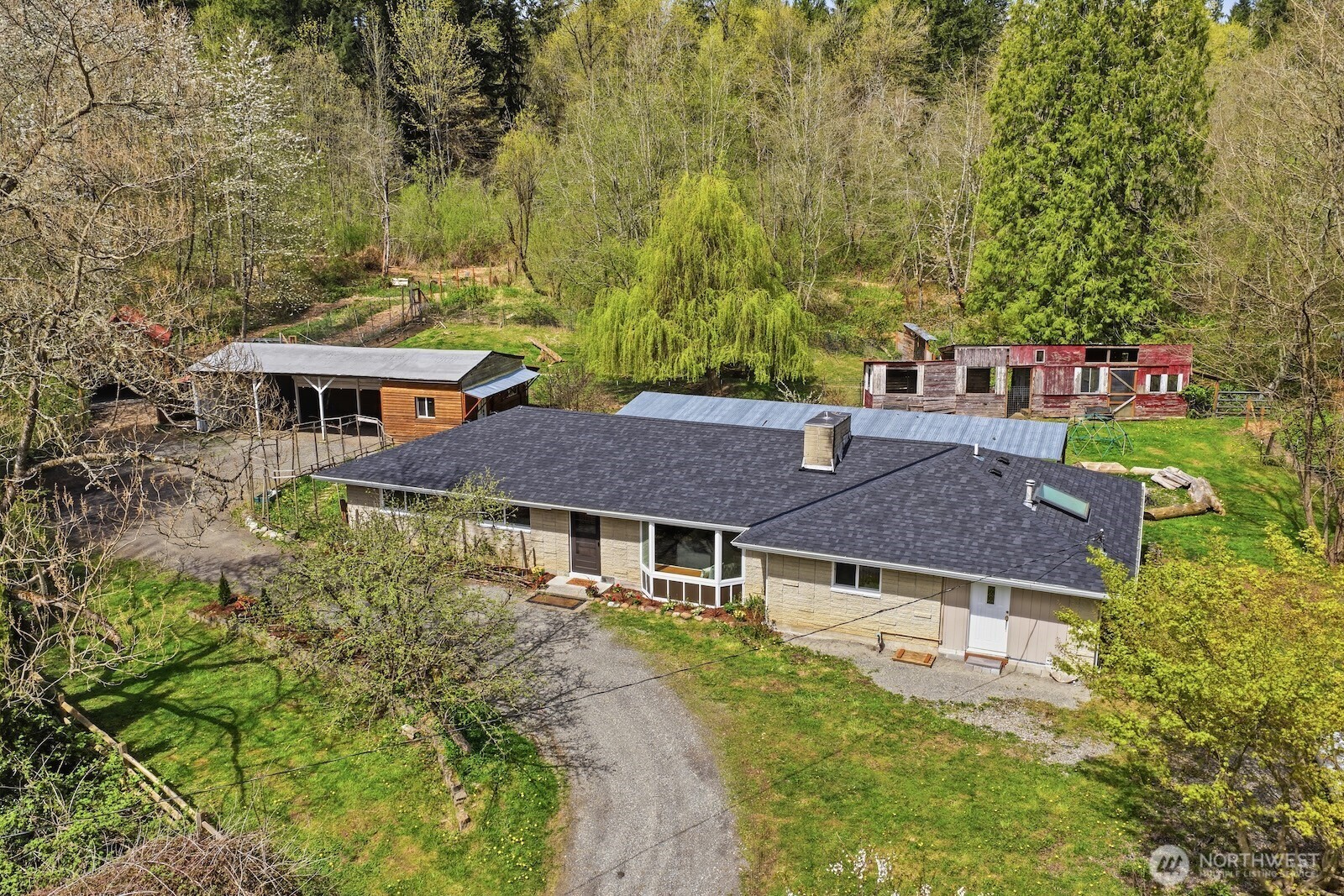 11617 Fay Road Northeast Carnation, WA 98014 - Photo 1 of 40 aerial view of a house with a yard and large trees