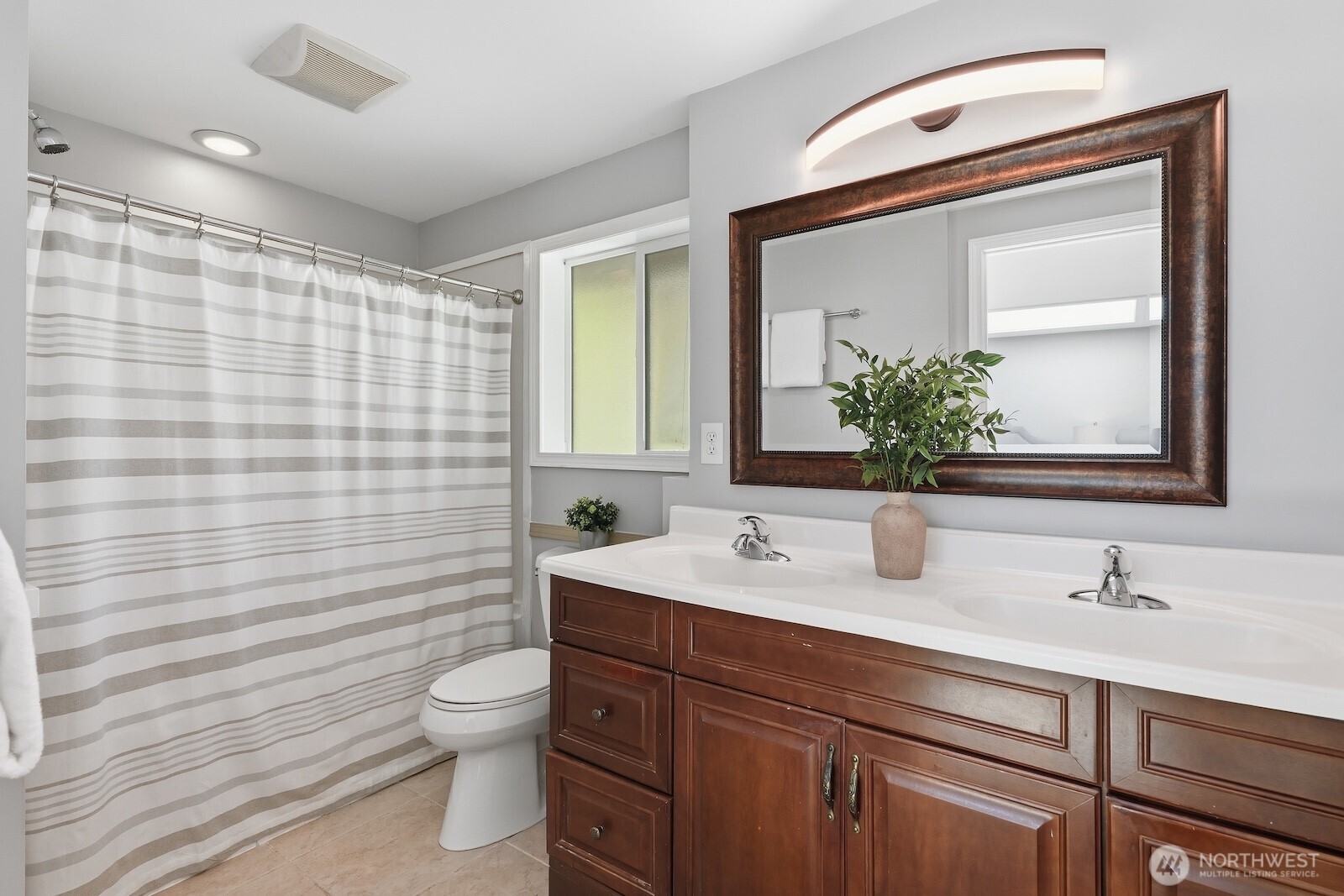11617 Fay Road Northeast Carnation, WA 98014 - Photo 15 of 40 a bathroom with a toilet a sink and mirror